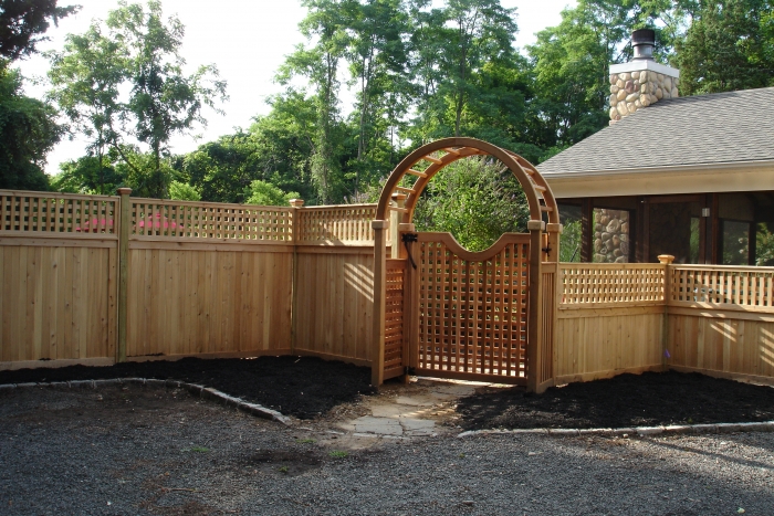 Custom Wood Fence with Large Cedar Arbor