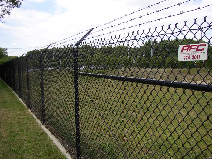 Black Commercial Chain Link Fencing with Barbed Wire